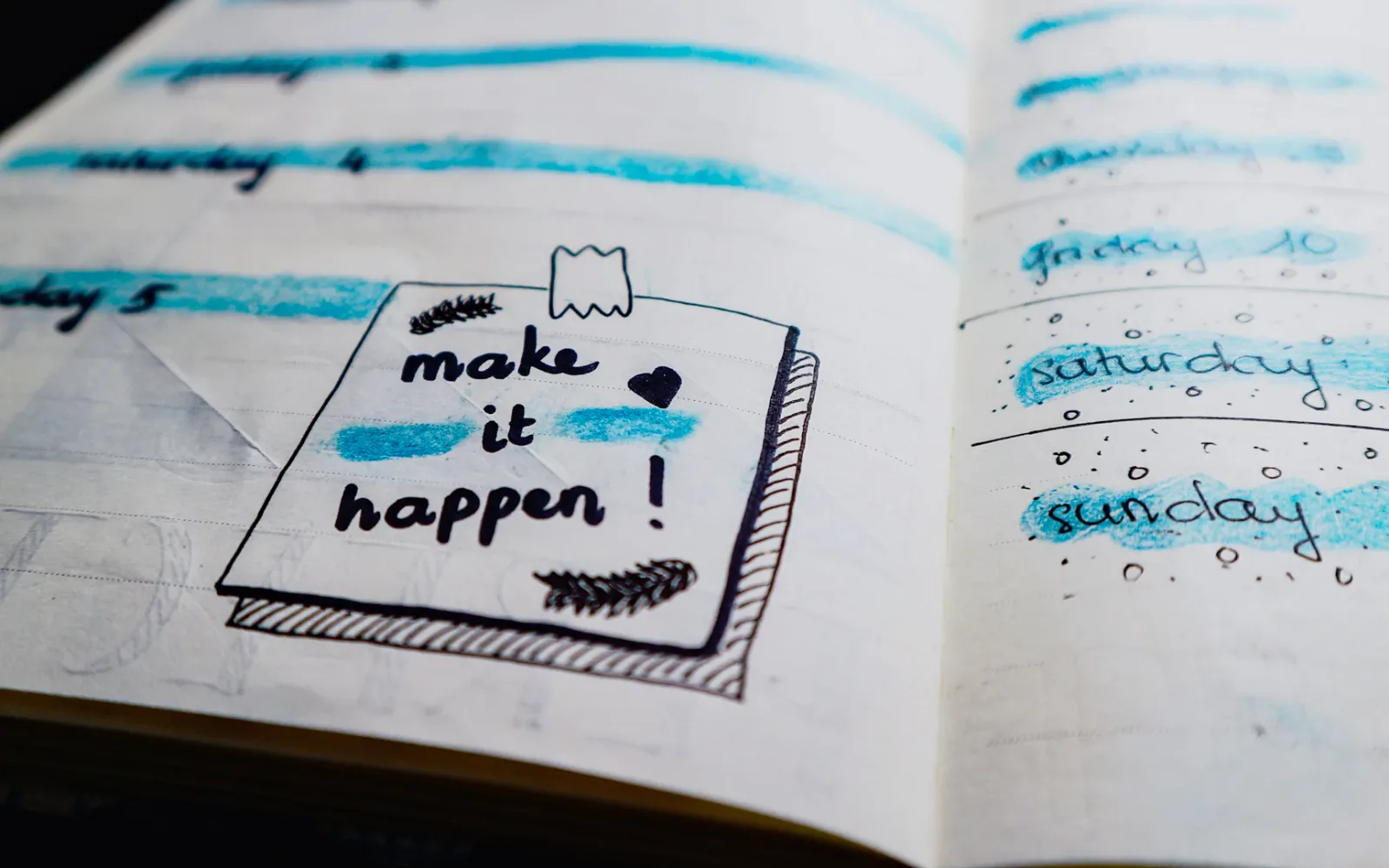 Diary with 'make it happen' text