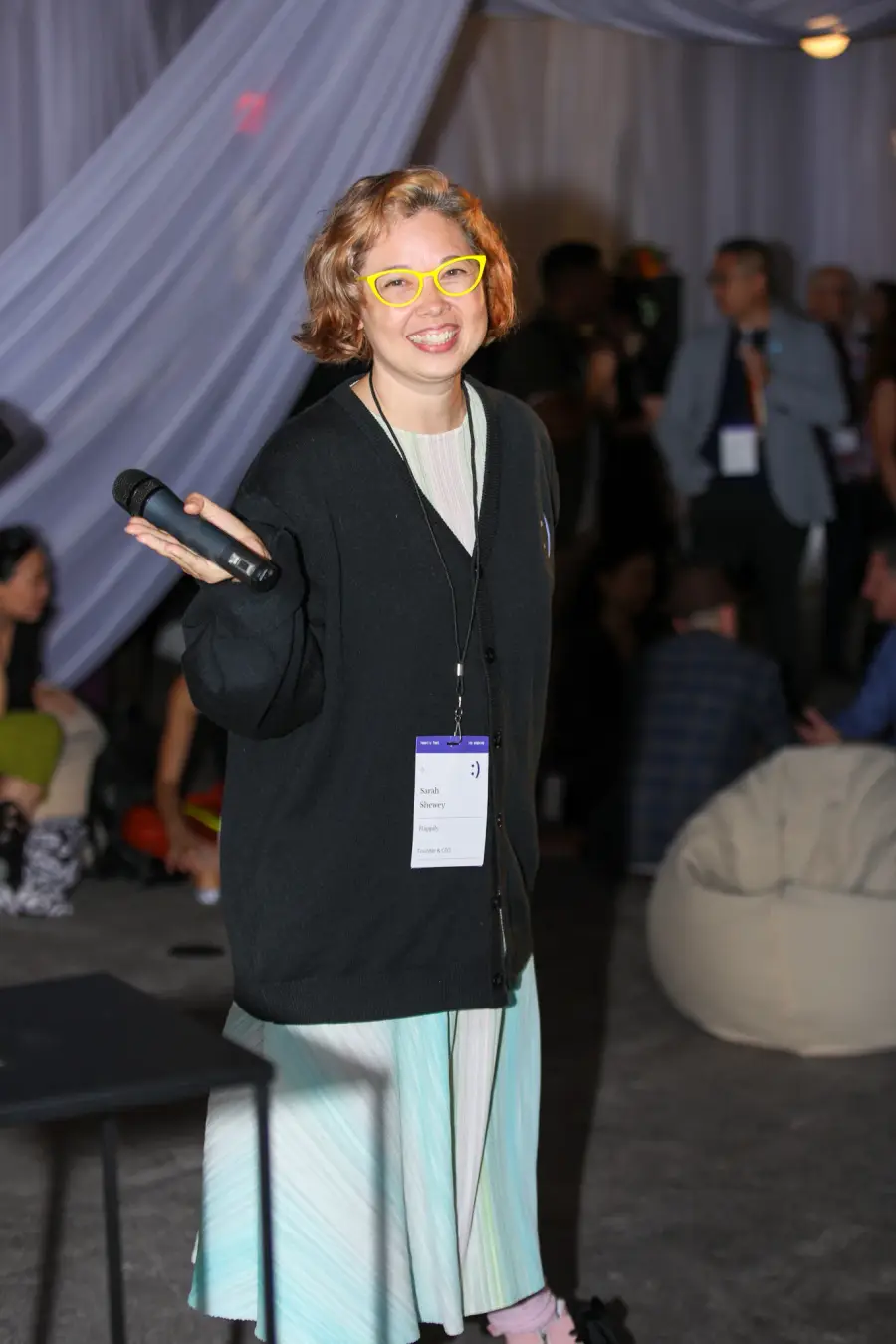 Sarah Shewey, founder and CEO of Happily, speaking at an event